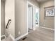 Hallway with access to bedrooms, featuring modern finishes and neutral decor at 1928 W 67Th Pl, Denver, CO 80221