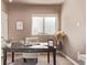 Cozy home office features a modern desk, a neutral chair, and lots of natural light at 1928 W 67Th Pl, Denver, CO 80221