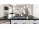 Modern kitchen featuring sleek countertops, stainless steel appliances, and seamless integration with the living space at 1928 W 67Th Pl, Denver, CO 80221
