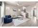 Bright living room with modern decor, open staircase, and comfortable furniture at 1928 W 67Th Pl, Denver, CO 80221