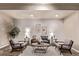 Comfortable living room showcasing a decorative rug, modern seating, and attractive wall art at 1928 W 67Th Pl, Denver, CO 80221