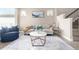 Cozy living room with a plush sofa, stylish coffee table, and natural light at 1928 W 67Th Pl, Denver, CO 80221