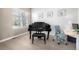 Bright living space featuring a grand piano, modern desk area, and large window with natural light at 1928 W 67Th Pl, Denver, CO 80221