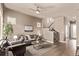 Spacious living room featuring a ceiling fan, neutral color palette and staircase at 1928 W 67Th Pl, Denver, CO 80221