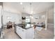 Bright, open-concept living space featuring a modern kitchen, dining area, and comfortable living room at 1928 W 67Th Pl, Denver, CO 80221
