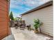 Private patio featuring comfortable seating and a beautifully landscaped area, ideal for outdoor living at 1928 W 67Th Pl, Denver, CO 80221