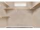 Bright walk-in closet with built-in shelving provides ample storage space at 1928 W 67Th Pl, Denver, CO 80221