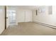 Spacious bedroom featuring neutral carpet, baseboard heat, and a generously sized window at 8595 S Yarrow St, Littleton, CO 80128