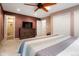 Spacious bedroom featuring a large bed, walk-in closet and ensuite bath at 8595 S Yarrow St, Littleton, CO 80128