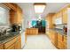 Functional kitchen showcasing ample counter space and seamless flow to living area at 8595 S Yarrow St, Littleton, CO 80128