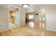 Open-concept living space featuring hardwood floors and seamless transitions at 8595 S Yarrow St, Littleton, CO 80128