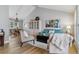 Open living room featuring modern furniture, hardwood floors, and an open view to the dining area at 7484 E Mercer Pl, Denver, CO 80237