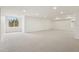 Large basement space with windows, neutral carpet, and recessed lighting offers endless possibilities at 5035 Vermillion Dr, Castle Rock, CO 80108