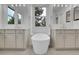 Stunning bathroom boasting a modern soaking tub nestled between and sinks and vanities at 5035 Vermillion Dr, Castle Rock, CO 80108
