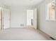 Neutral bedroom featuring a bright atmosphere with white walls, carpet flooring, and a large window at 5035 Vermillion Dr, Castle Rock, CO 80108