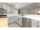 Modern kitchen with gray cabinets, marble countertops, and stainless steel appliances at 1020 Stuart St, Denver, CO 80204