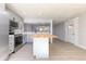 Modern kitchen island with gray cabinets and stainless steel appliances at 1020 Stuart St, Denver, CO 80204