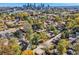 A Denver neighborhood shows colorful fall foliage and city skyline providing vibrant scenery and urban proximity at 2436 W 34Th Ave, Denver, CO 80211