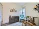 Bright Bedroom with a stylish accent chair, gray dresser, and colorful book display at 2436 W 34Th Ave, Denver, CO 80211