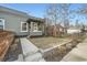 Charming home featuring painted brick, well-maintained lawn, and a concrete walkway leading to a cozy front porch at 2436 W 34Th Ave, Denver, CO 80211