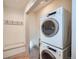 Convenient laundry room features a stacked washer and dryer for efficient chores at 2436 W 34Th Ave, Denver, CO 80211