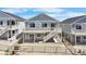 Back exterior of a lovely two-story home featuring a spacious deck, steps and a fenced yard at 2143 Peralta Loop, Castle Rock, CO 80104