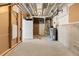 Unfinished basement featuring HVAC and a door at 2143 Peralta Loop, Castle Rock, CO 80104