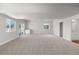 Spacious carpeted basement with natural light, neutral paint, and a stylish bar area perfect for entertaining at 2143 Peralta Loop, Castle Rock, CO 80104