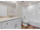 Bright bathroom featuring a granite-topped vanity and a shower over tub with white subway tile surround at 2143 Peralta Loop, Castle Rock, CO 80104