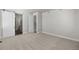 Bright bedroom features neutral carpet, white trim, and a sliding barn door that adds a touch of modern farmhouse style at 2143 Peralta Loop, Castle Rock, CO 80104