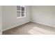 Bedroom featuring neutral carpet, white walls, and a bright window at 2143 Peralta Loop, Castle Rock, CO 80104