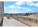 Large deck with white railing overlooking the neighborhood at 2143 Peralta Loop, Castle Rock, CO 80104