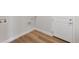 A well-lit laundry room featuring hardwood flooring and a door to outside at 2143 Peralta Loop, Castle Rock, CO 80104