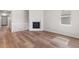 Bright living room with wood floors, fireplace and open layout, great for gatherings at 2143 Peralta Loop, Castle Rock, CO 80104