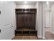 Mudroom with ample dark wood storage and a door to the house at 2143 Peralta Loop, Castle Rock, CO 80104