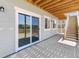 Covered outdoor patio featuring stairs and a sliding glass door at 2143 Peralta Loop, Castle Rock, CO 80104