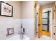 Bright bathroom featuring a bathtub, tiled walls, and modern shower fixtures at 11224 W 28Th Pl, Lakewood, CO 80215