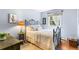 Comfortable bedroom with a decorative iron bed frame and a large window at 11224 W 28Th Pl, Lakewood, CO 80215
