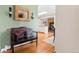 Inviting entryway with a wooden bench and a view into the kitchen and dining area at 11224 W 28Th Pl, Lakewood, CO 80215
