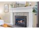 Elegant fireplace with a decorative mantel and a mosaic tile surround at 11224 W 28Th Pl, Lakewood, CO 80215
