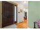 Welcoming foyer with a dark wood door, hardwood floors, and a view into the living spaces, creating an inviting entrance at 11224 W 28Th Pl, Lakewood, CO 80215