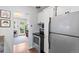 Open-concept kitchen showcasing stainless steel appliances and view to living area at 11224 W 28Th Pl, Lakewood, CO 80215