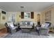 Relaxing sun room featuring wicker furniture, decorative pillows, and natural light at 11224 W 28Th Pl, Lakewood, CO 80215