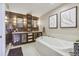Luxurious bathroom with a modern soaking tub, wood accents, and sophisticated lighting fixtures at 1499 Blake St # 6K, Denver, CO 80202