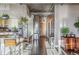Modern kitchen with barstool seating, stainless steel appliances, granite countertop, and hardwood floors at 1499 Blake St # 6K, Denver, CO 80202