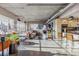 Spacious living room featuring hardwood floors, exposed ductwork, and large windows for lots of natural light at 1499 Blake St # 6K, Denver, CO 80202