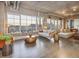Inviting living room with large windows offering city views, stylish furnishings, and ample natural light at 1499 Blake St # 6K, Denver, CO 80202