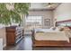 Comfortable main bedroom with a large window providing city views, hardwood floors, and warm natural light at 1499 Blake St # 6K, Denver, CO 80202