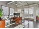 Office space with hardwood floors, a large desk, and a door to a balcony with city views at 1499 Blake St # 6K, Denver, CO 80202