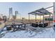 Stylish rooftop deck with covered lounge seating and breathtaking city views at 1499 Blake St # 6K, Denver, CO 80202